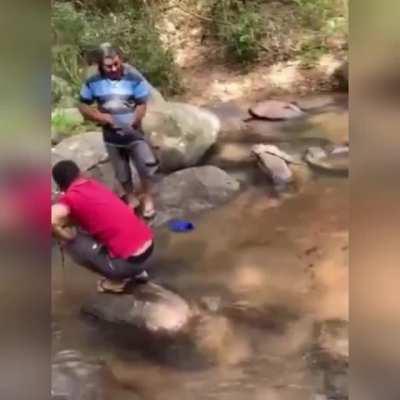 Fishing with a rifle, Elmer Fudd style.