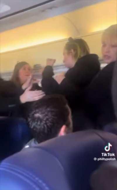 Airplane freakout! This karen is screaming about being human trafficked… 🤔