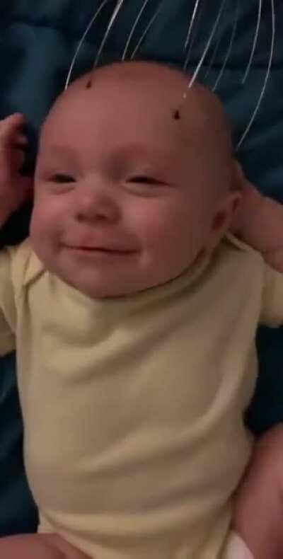 This baby loves to get his head massaged...