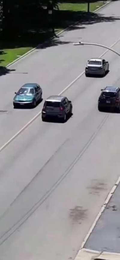 Dude throws rocks at car