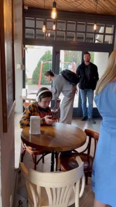 Angelina Jolie is in Lviv, Ukraine. But I really love that kid in headphones who does not care about it.