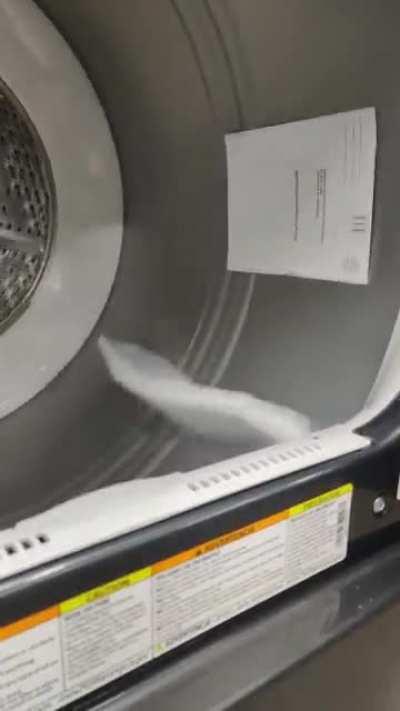 A piece of paper in a dryer with a broken door switch