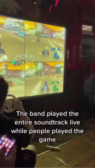 Band plays Mario Kart soundtrack live to patrons playing the game