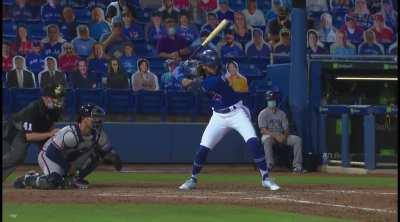 Bo Bichette swings at a baseball