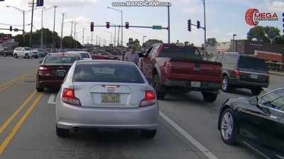 Karen gets in other drivers face before realizing she's the smaller weaker one and backing off.