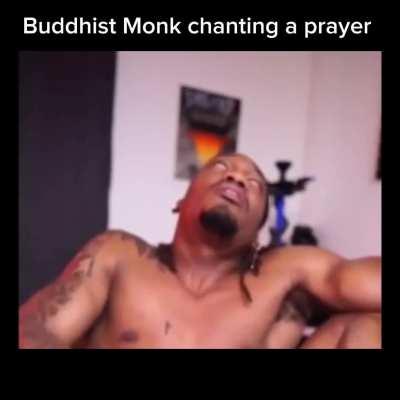 Buddhist Monk chanting a prayer