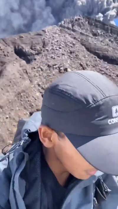 Tourists at the summit of Mount Raung during its eruption in Indonesia on DEC 24, 2024