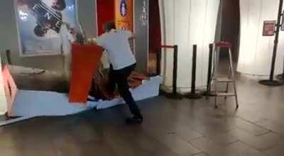 Theater worker destroys Mulan display after Disney announces it's going straight to streaming