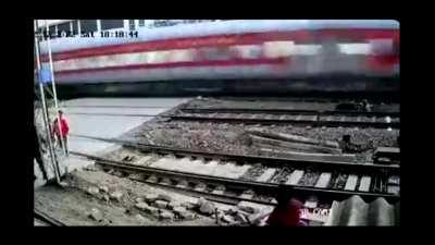 Biker almost gets hit by train