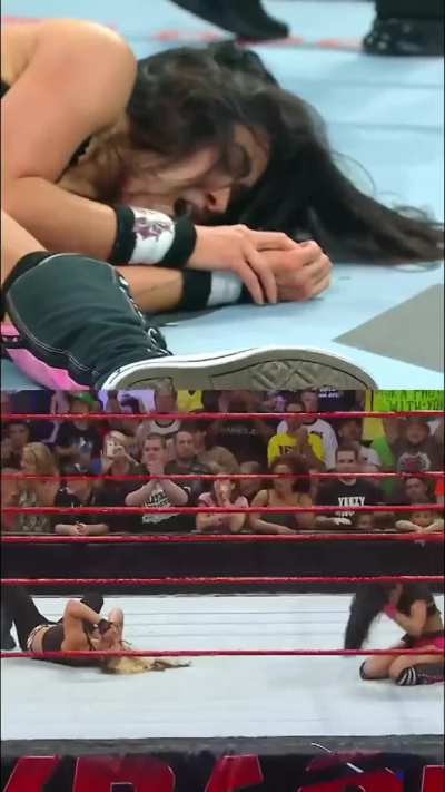 AJ Lee winning her first and latest championship belt