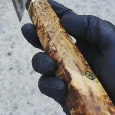 Chef's knife forged out of three-layer steel: high carbon black core and mirror polished stainless.