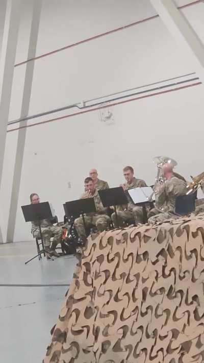 US Army band olaying helldivers theme at welcome home ceremony