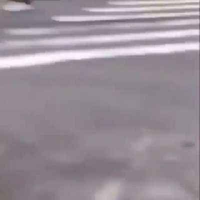 Dude gets lit up by multiple paintball guns