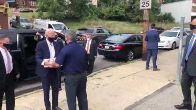 Joe Biden tells a Trump supporter standing on a truck heckling him, ”Don’t jump.”