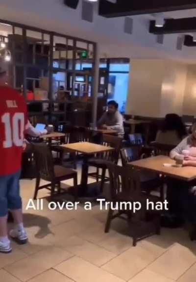 White man upset at black man for wearing a MAGA hat. Ohhh😱