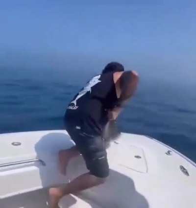 Returning a fish to its home.