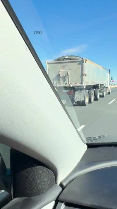 Truck spilling load all over 401.