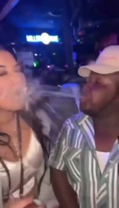 To spit her drink on a stranger