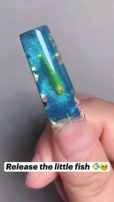 Putting a live fish in your nail as nail art... WTF