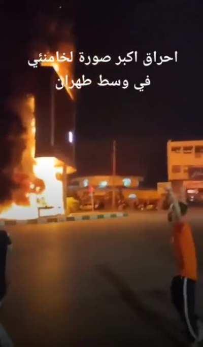 The largest picture of Ali Khamenei (supreme leader of Iran) was burned in the center of Tehran