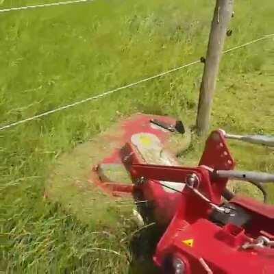 Mower that doesn't leave grass around posts