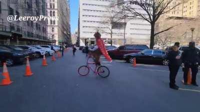 As Trumpanzees arrive in Manhattan, one has been seen riding a clown bike while wearing a cape and shouting 