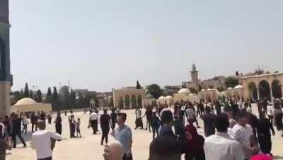 Israeli forces firing stun grenades and rubber coated bullets at Palestinians around al-aqsa mosque, Jerusalem.