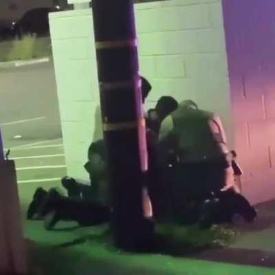 They secluded him behind a wall and looked around to see if anyone was watching so they can beat him... this is why we protest