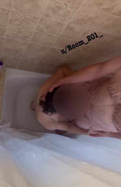 Sucking his cock in the shower 