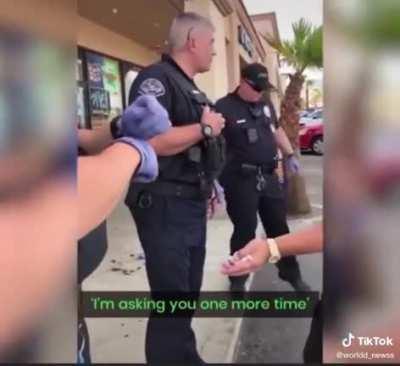 Police officer “detains” guy after getting in his face