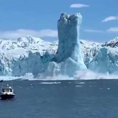 Ice breaking off a glacier, the smaller piece being less dense means it shoots out the water before collapsing on itself