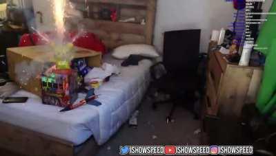YouTuber Ishowspeed sets off firework in his room.