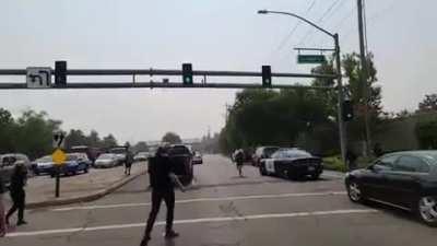 BLM rioter yeeted from police cruiser as it drives away