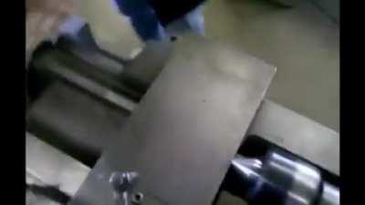 Never try to out muscle an industrial lathe.