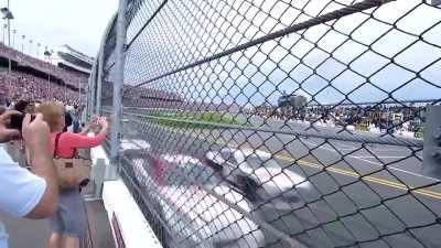 The sheer power and speed, trackside at a NASCAR race. 