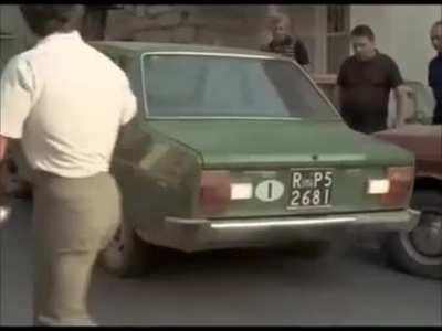 Franco Columbu lifting a car, being a badass