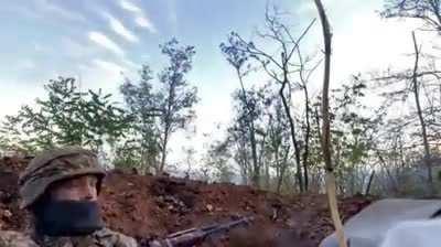 Ukrainian soldier drinking coffee while fighting (somewhere between Lyman and Bakhmut)