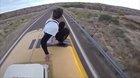 Jumping off a moving bus off of a bridge