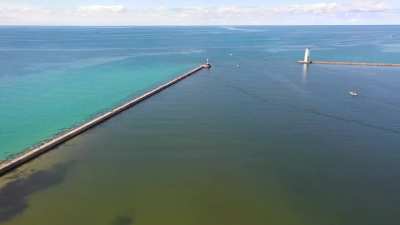 Aerial video showing Caribbean-like blue waters of Benzie County, MI
