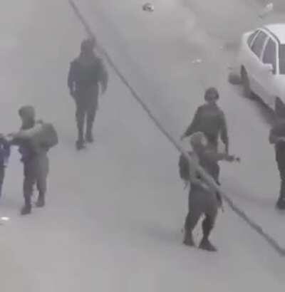WATCH: ⁦(O_O) isreali occupation soldiers use a Palestinian Child as their human shield. Then the occupiers throw tear gas bombs into the Palestinian Houses.