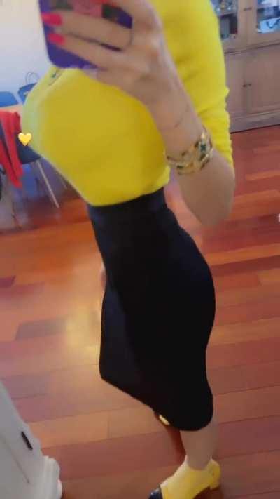 Yellow top, tight black skirt