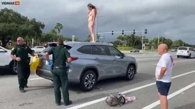 Woman in Florida strips naked, masturbates, and pisses on someone else’s car.