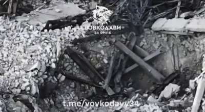 After the Russian soldier is wounded, his comrade grabs his rifle and quickly scrambles back into his hole. Vovchansk, Kharkiv Region