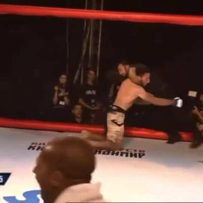 Referee chokes out fighter after he was knocked out