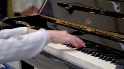 Lucy (13) who is blind, non-verbal and neuro diverse playing the piano.