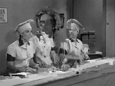 Lucille Ball and Vivian Vance struggle to keep up with a chocolate conveyer belt in a candy factory, in a 1952 episode of 