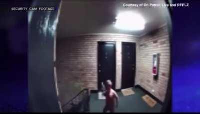 A father was arrested after his toddler was caught on camera carrying a gun