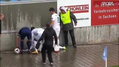 Player knocked out after crashing his head into a concrete wall.