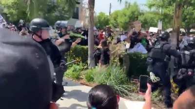 LAPD beats protesters who have their hands up