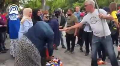 Mother tells her kid to stomp on pride flag in Ottawa